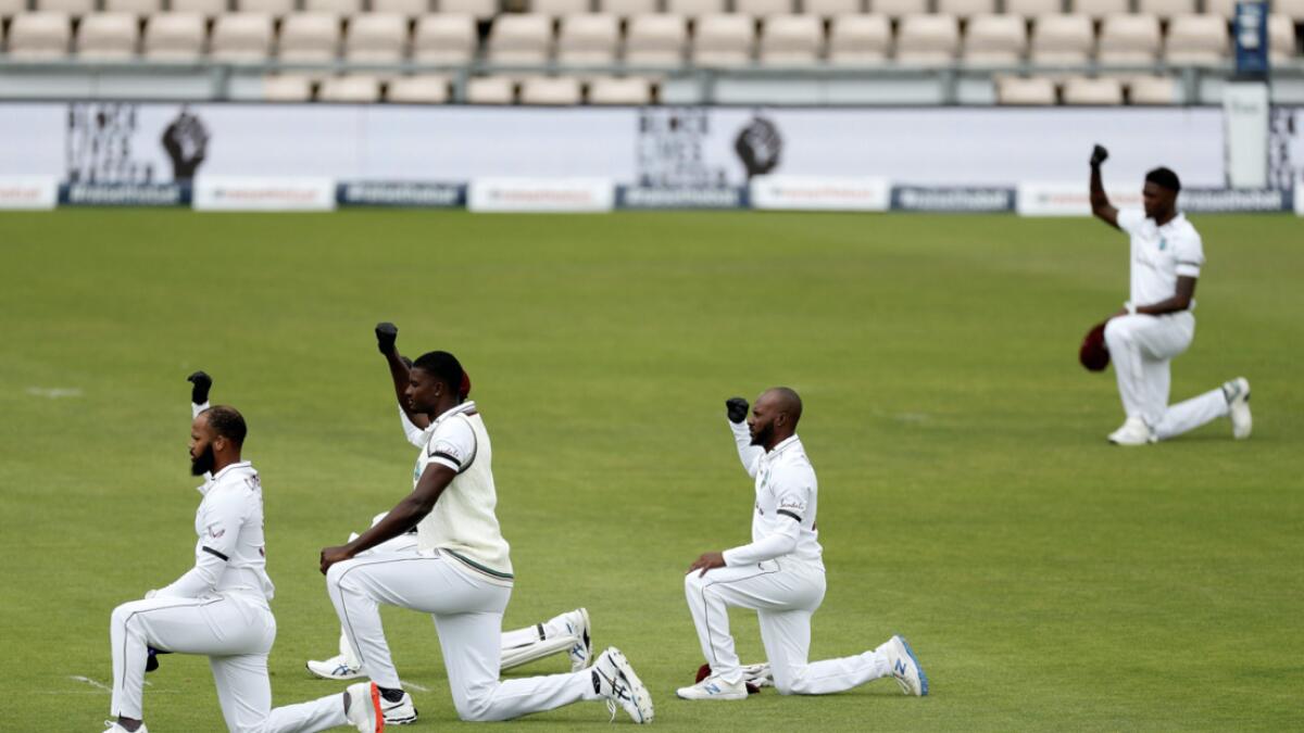 Players 'takes a knee' in support of the Black Lives Matter movement on the first day of the first Test cricket match between England and the West Indies at the Ageas Bowl in Southampton, southwest England. Photo: AFP