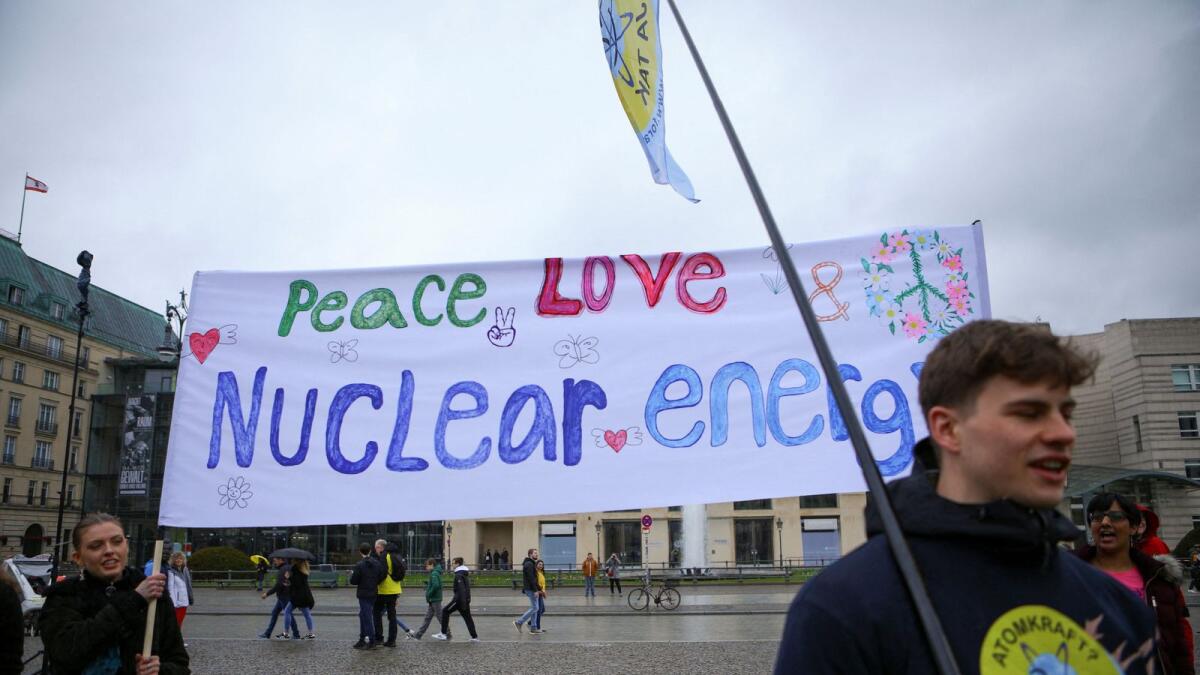 People take part in a protest against the shut down of the last three German nuclear power plants in Berlin, Germany, on Saturday. — Reuters