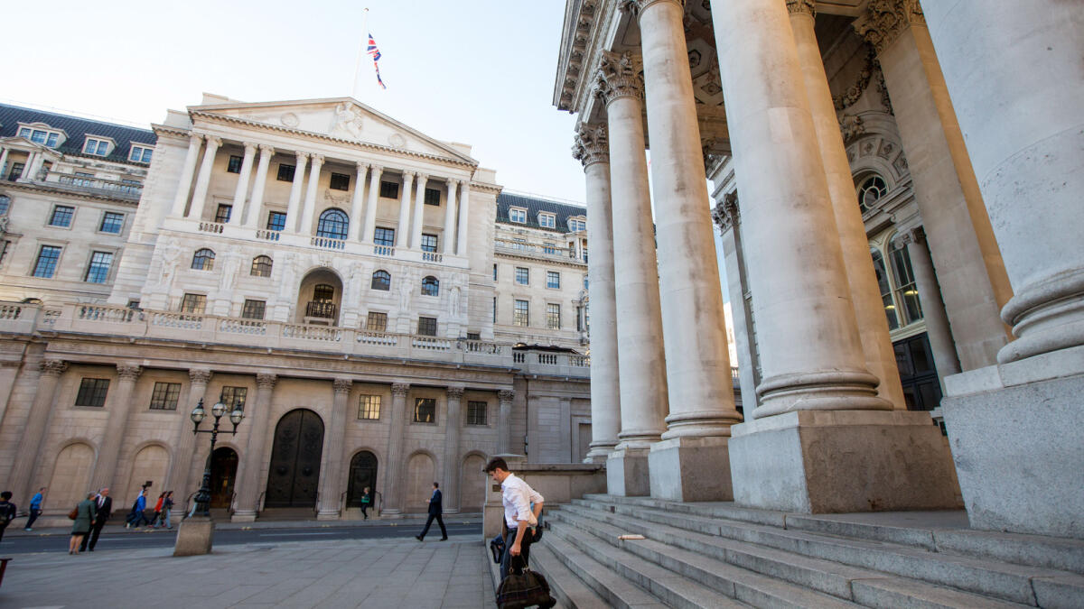 Pedestrians pass in front of the BoE in London.The United States, UK and Sweden all left rates steady this week. — FILE PHOTO