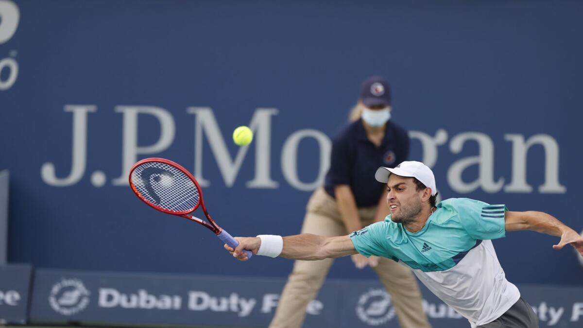 Aslan Karatsev hits a forehand return during his match on Thursday. (Supplied photo)