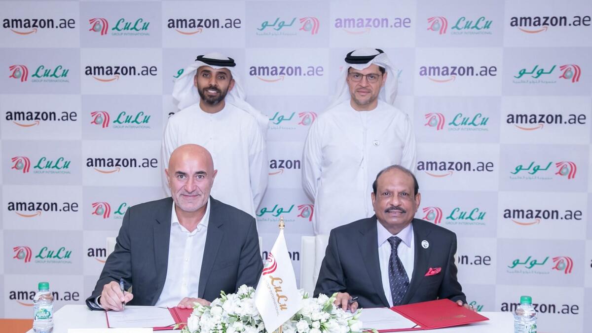 Ronaldo Mouchawar, vice-president for Amazon Middle East and North Africa, and Yusuffali MA, chairman and managing director of Lulu Group, signing the agreement in Abu Dhabi on Wednesday. — Supplied photo 