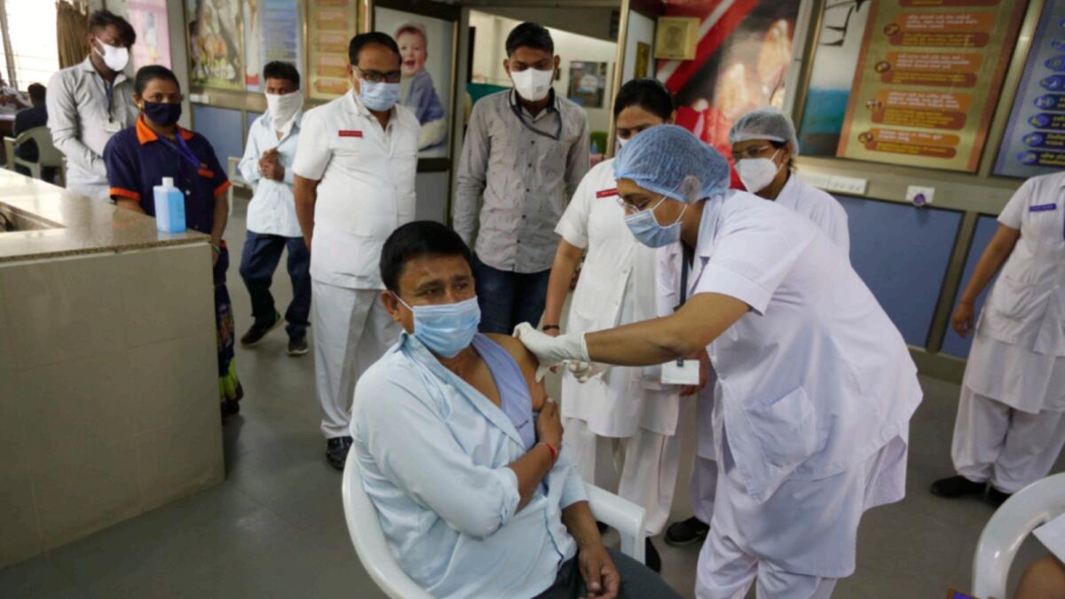 A hospital staff receives a Covid-19 vaccine at a government Hospital in Ahmedabad. — AP