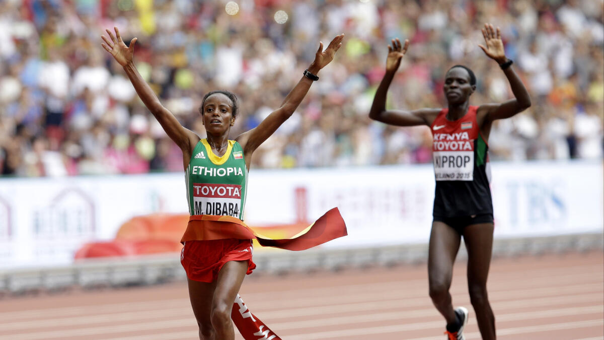 Dibaba dashes to marathon gold
