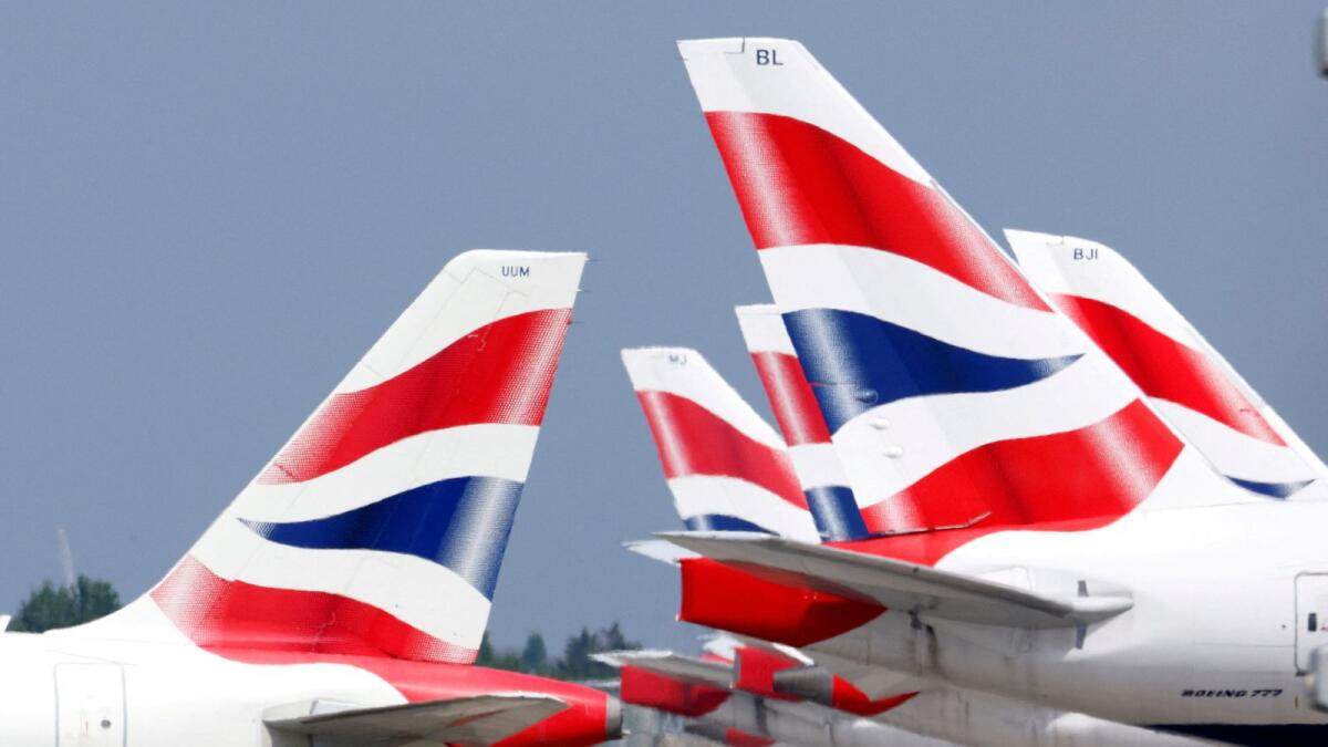 British Airways tail fins are pictured at Heathrow Airport in London, Britain. — Reuters file