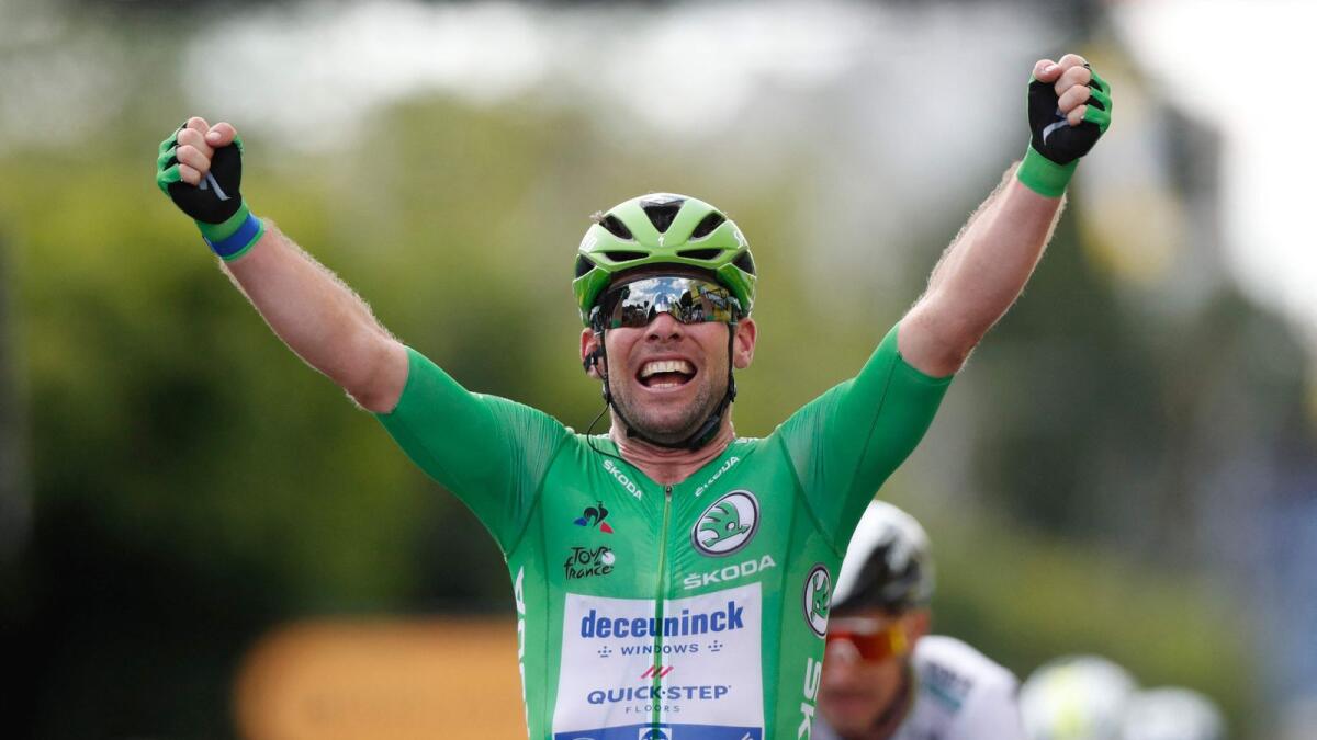 Team Deceuninck Quickstep's Mark Cavendish celebrates as he crosses the finish line. (AFP)