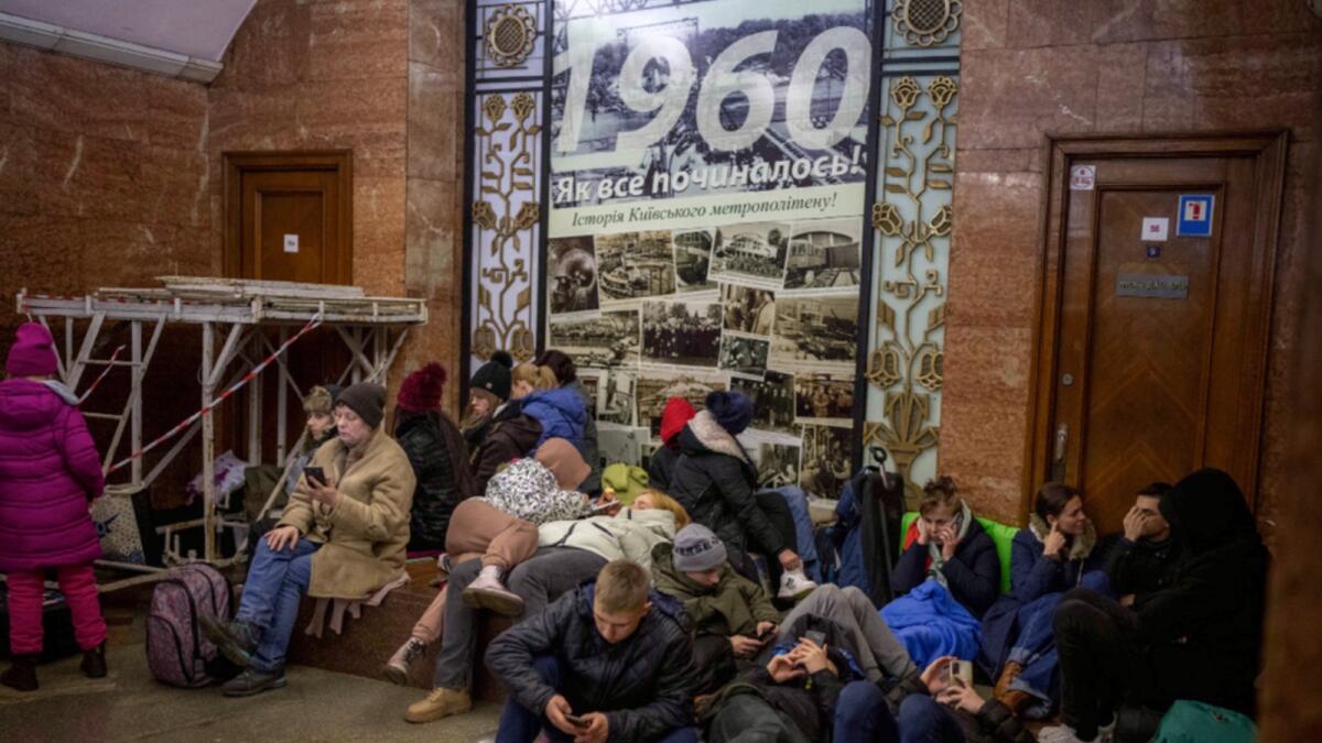 People rest in the Kyiv subway, using it as a bomb shelter. — AP