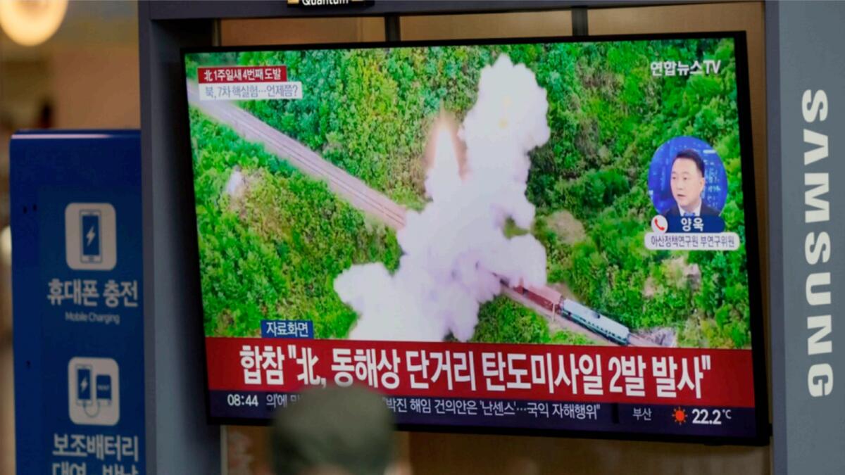 A TV screen showing a news programme reporting about North Korea's missile launch with file footage, is seen at the Seoul Railway Station. — AP