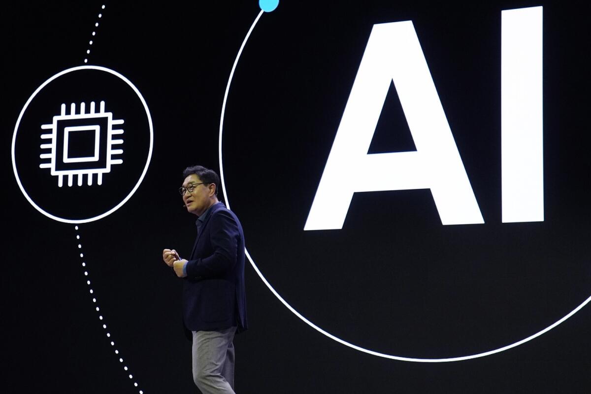 JH Han, CEO and Head of the Device Experience Division at Samsung Electronics, speaks during a Samsung press conference ahead of the CES tech show on Monday in Las Vegas. — AP