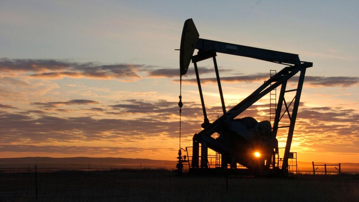 A pump jack pulling crude oil from the Bakken region of the Northern Plains near Bainville, Montana. — AP