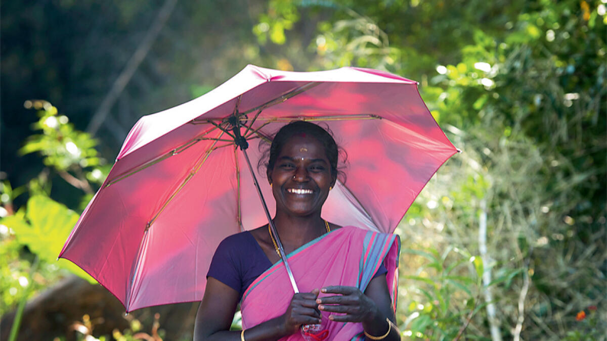Expats help tribals with umbrella project