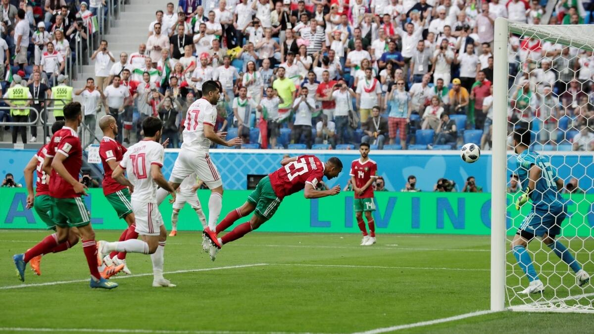 Moroccos Bouhaddouzs own goal hands Iran late victory
