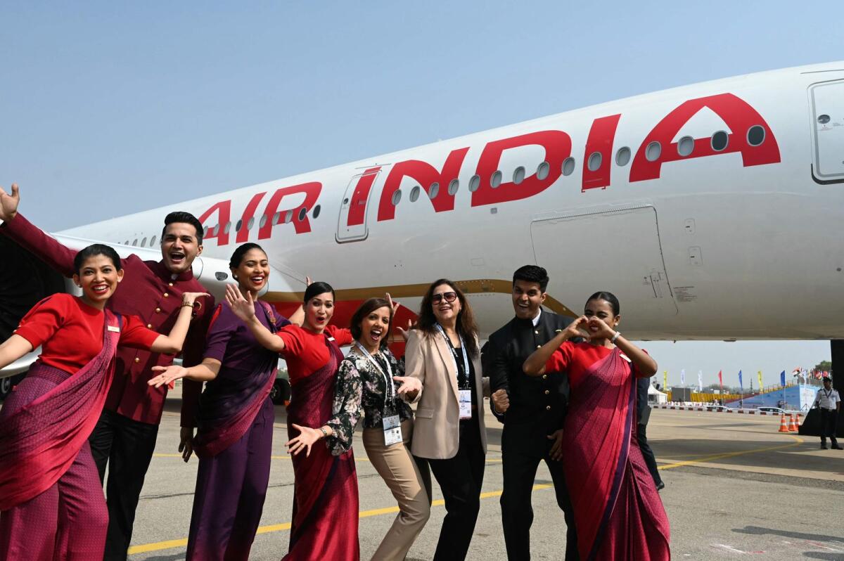 Crew members pose next to India's first Airbus A350 of Air India airline during the 'Wings India 2024', an exhibition and conference on civil aviation, at the Begumpet Airport in Hyderabad on January 18, 2024. — AFP file photo used for illustrative purpose only