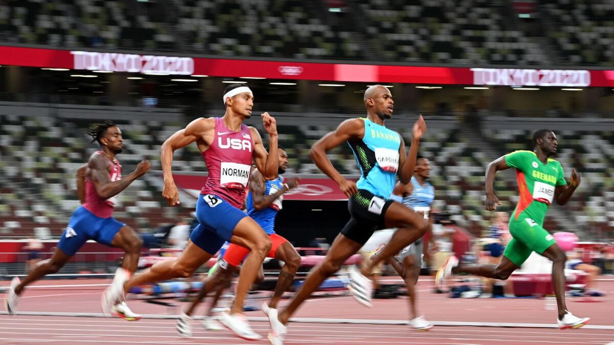 Steven Gardiner of the Bahamas in action on his way to winning gold alongside Michael Norman of the United States and bronze medallist, Kirani James of Grenada. — Reuters