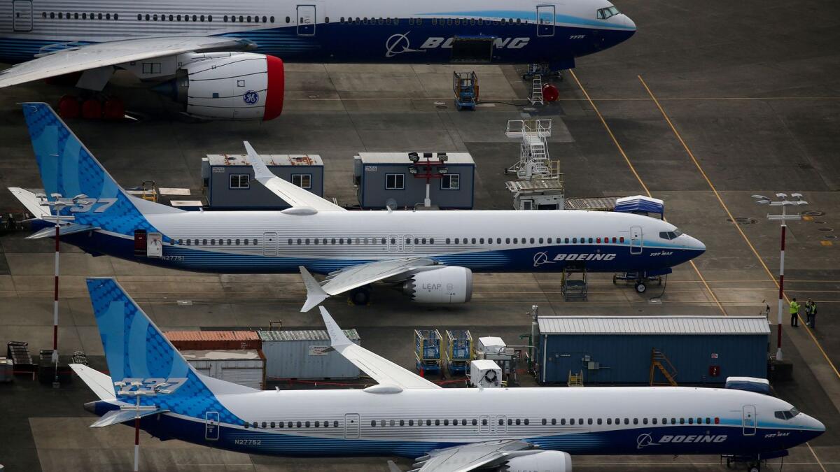 An aerial view of a Boeing 777X airplane (top) parked next to Boeing 737 MAX 10 airplanes at King County International Airport-Boeing Field in Seattle, Washington. — Reuters