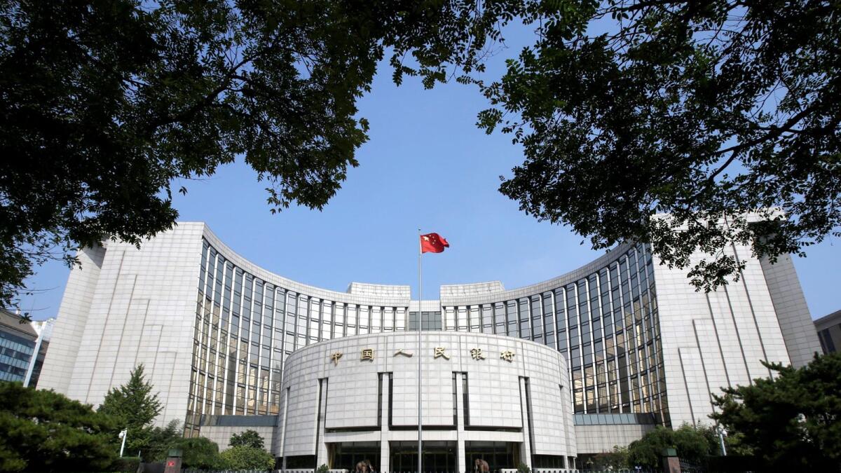 Headquarters of the People's Bank of China (PBOC), the central bank, is pictured in Beijing. China will focus on maintaining stability in its macro policies over the second half, and will not inject massive liquidity through 'flood-like' measures, the bank said. -- Reuters file photo