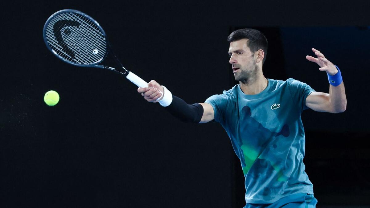 Serbia's Novak Djokovic hits a return during a practice session in Melbourne. - AFP