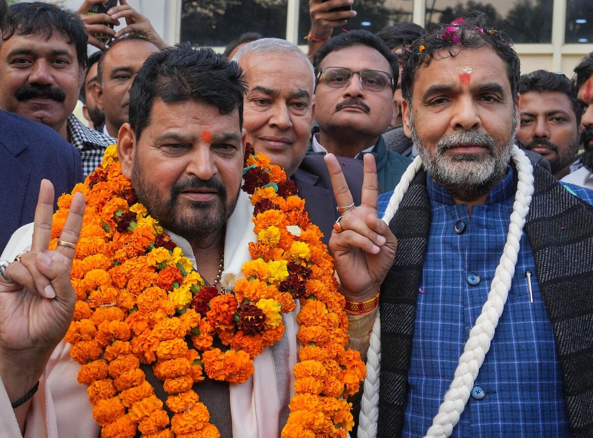 Photo: BJP MP Brij Bhushan Sharan Singh with president of the Wrestling Federation of India Sanjay Singh at his residence, in New Delhi. PTI