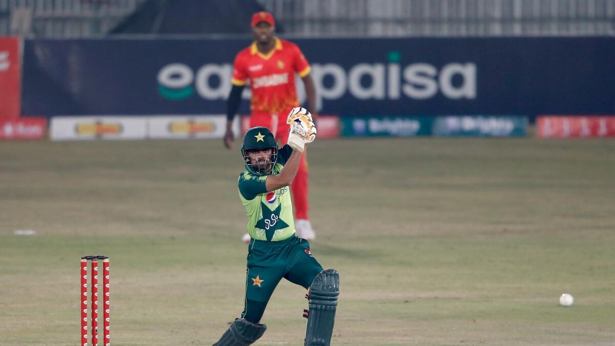 Babar Azam hits a boundary during the first Twenty20 match against Zimbabwe. — AP