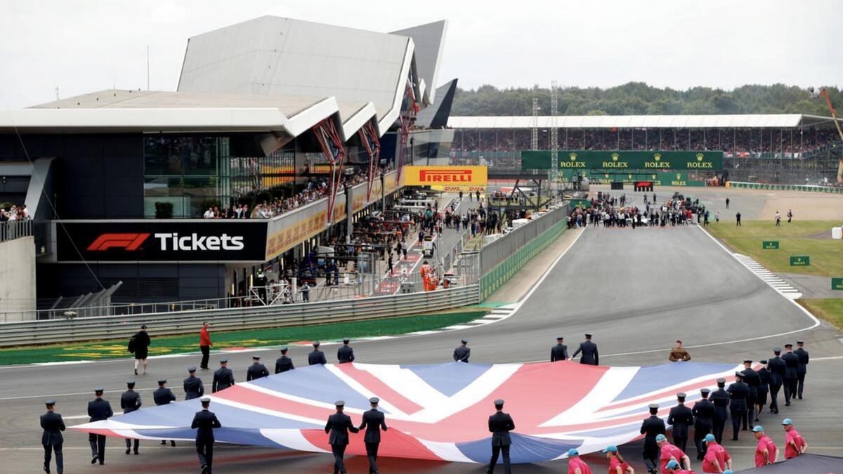 General view of a Union Jack flag being carried out on to the track by service personnel before last year's race. - Reuters file