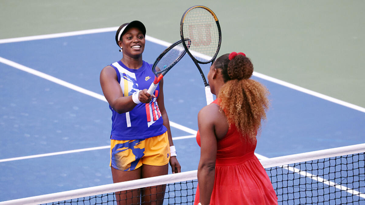 Sloane Stephens (left) greets Serena Williams at the net after their third round match in the 2020 US Open. -- AFP