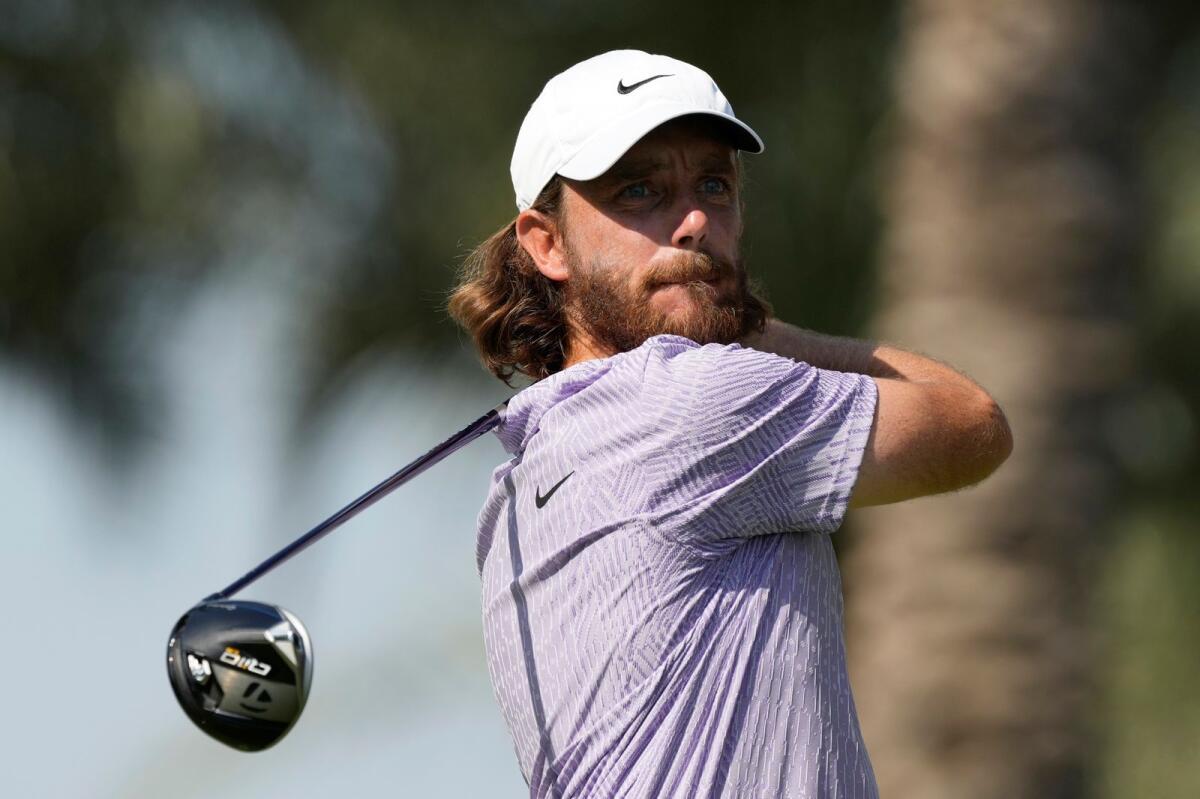 Tommy Fleetwood of England tees off on the 7th hole during the final round of Dubai Invitational golf tournament. — AP