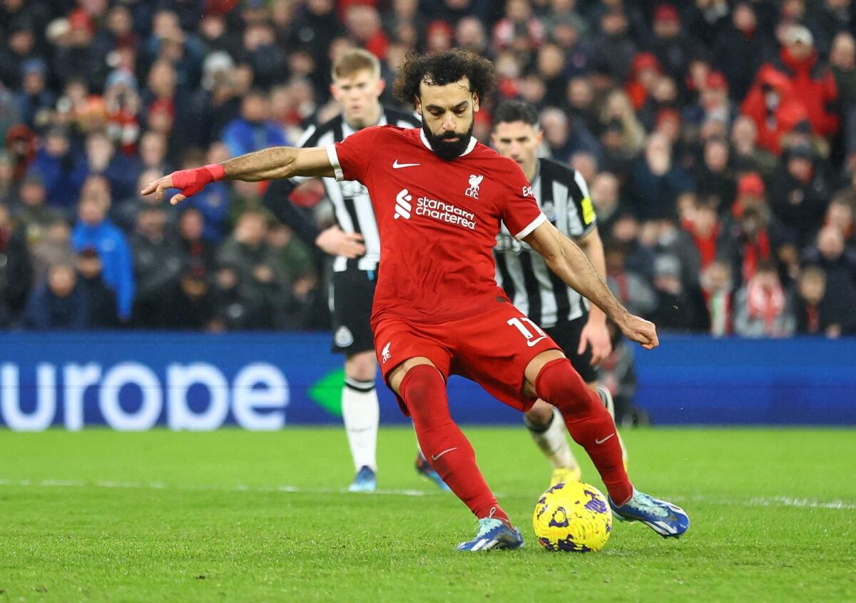 Liverpool's Mohamed Salah scores against Newcastle United. — AFP