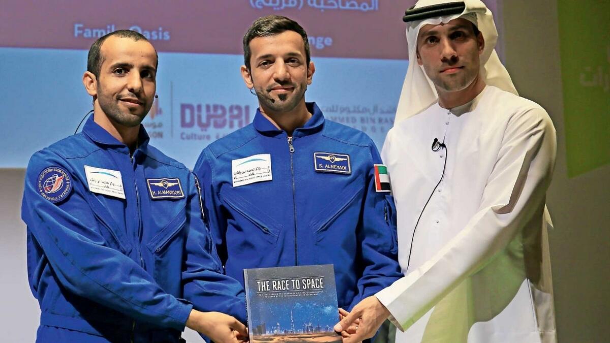 Hazza Al Mansouri and Sultan Al Nayadi with Salem Al Marri during the release of the book Race to Space at the Emirates Literature Festival in Dubai.—Photo by Neeraj Murali