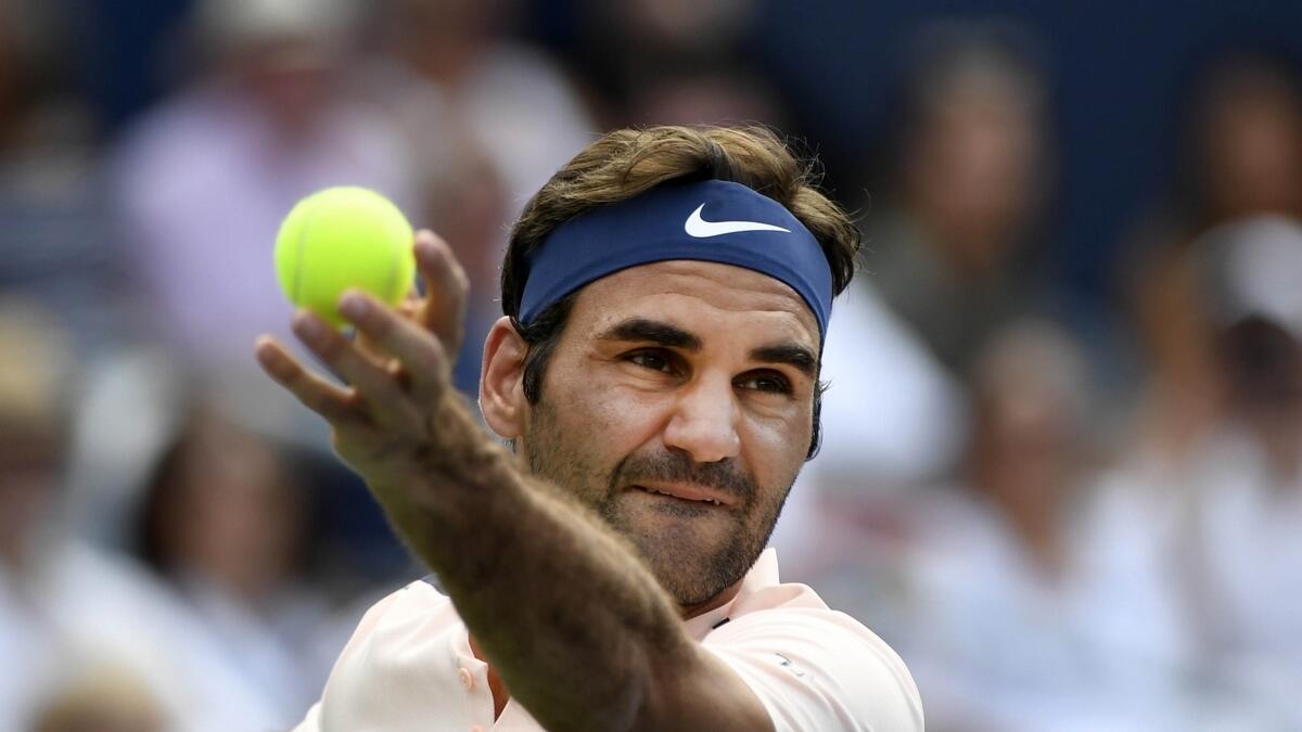 Federer says third major of the year would be surreal