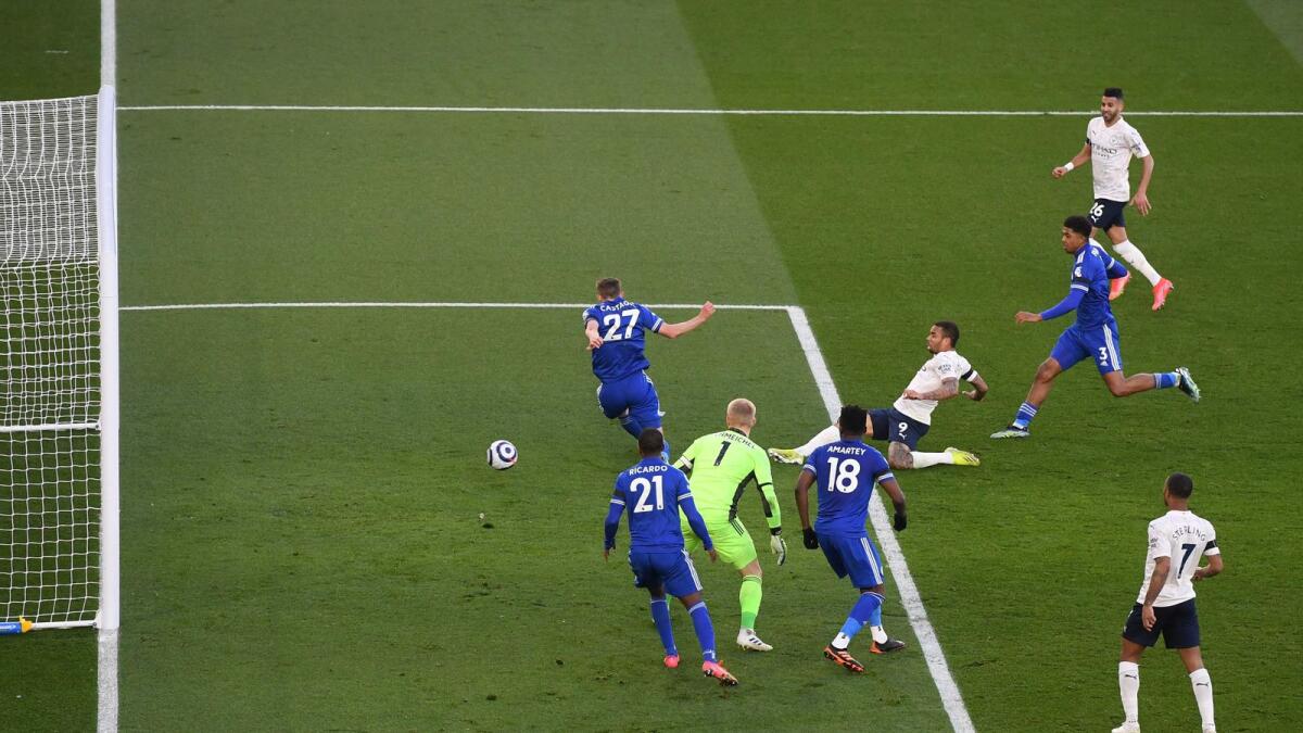 Manchester City's Brazilian striker Gabriel Jesus (centre right) shoots to score a goal against Leicester City during the English Premier League match. — AFP