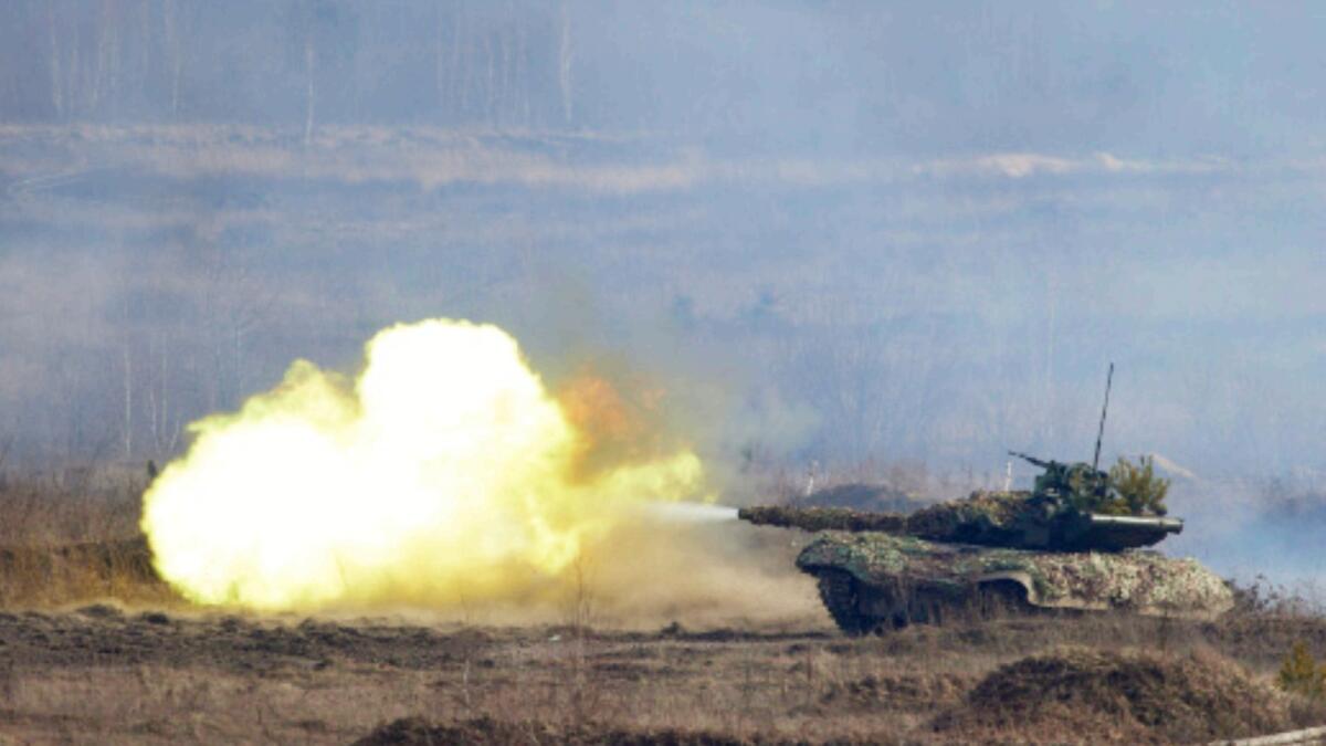 Ukrainian troops take part in a military drill outside the city of Rivne, northern Ukraine. — AP