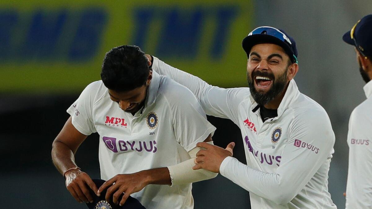 Indian captain Virat Kohli and Washington Sundar celebrate a wicket. (BCCI)