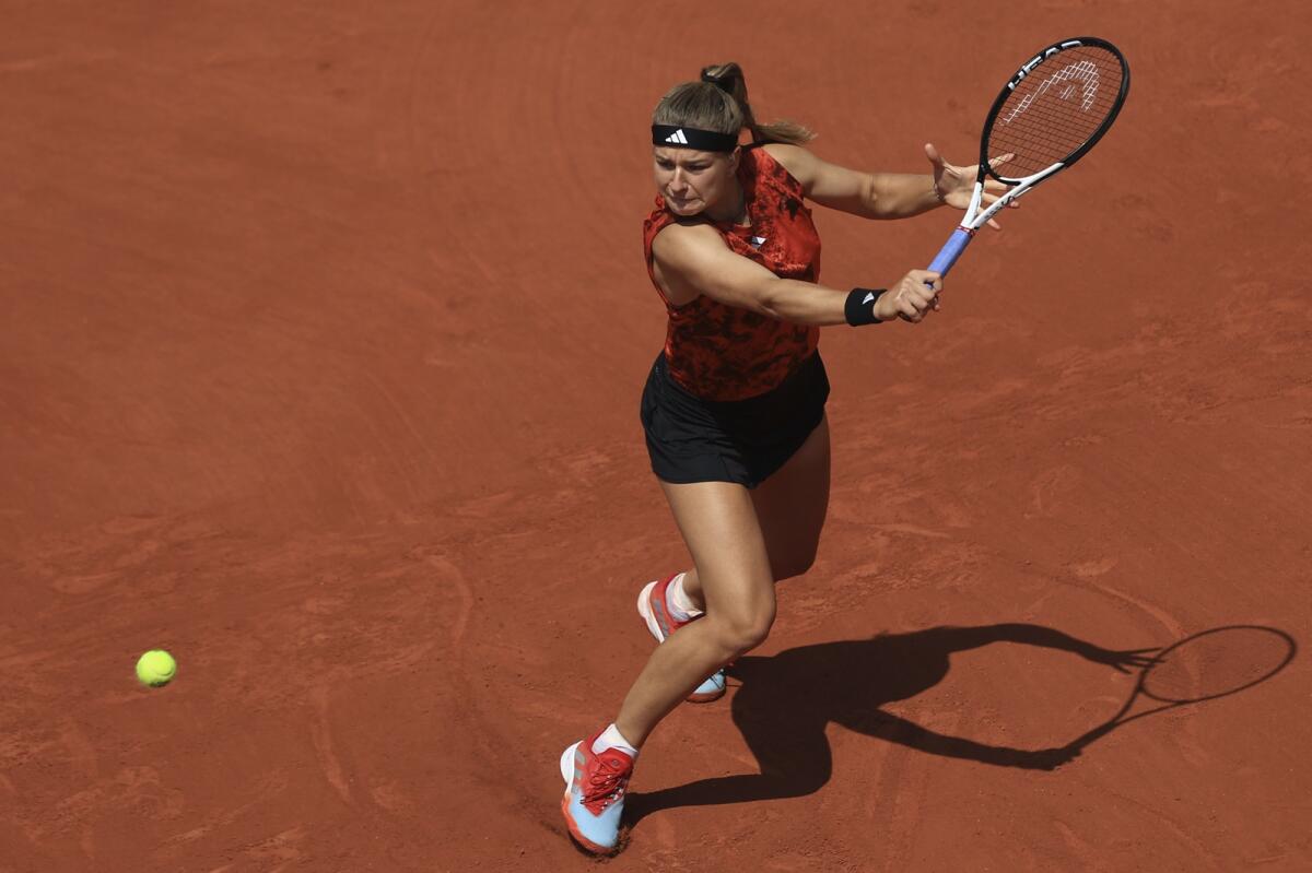 Czech player Karolina Muchova in action against Anastasia Pavlyuchenkova of Russia at Roland Garros on Tuesday. - AP