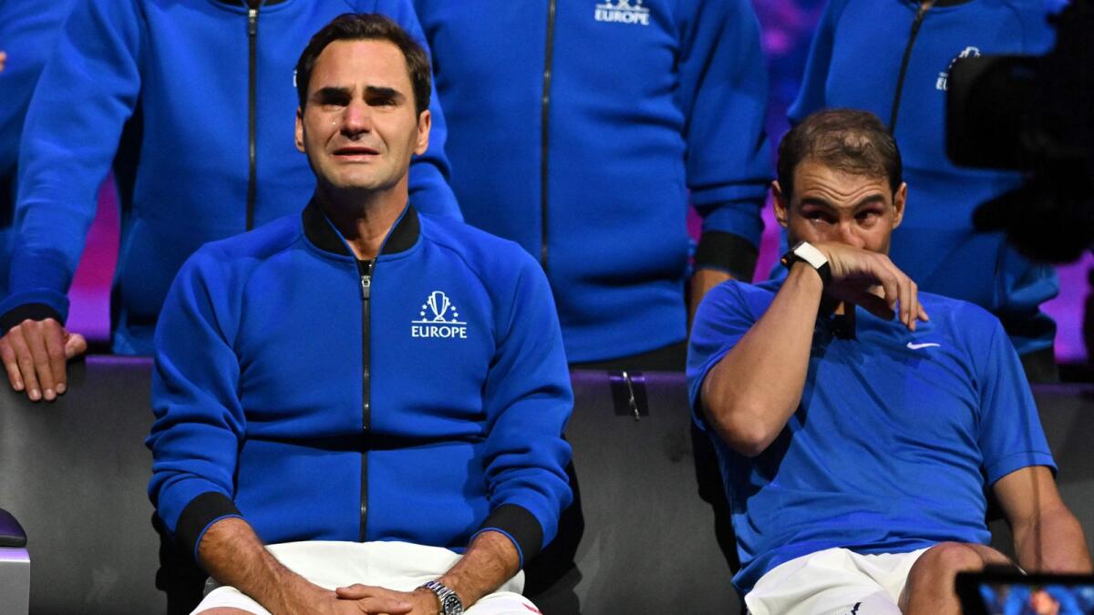 Roger Federer (left) sheds a tear after playing his final match, a doubles with Spain's Rafael Nadal (right) in the 2022 Laver Cup in London. – AFP