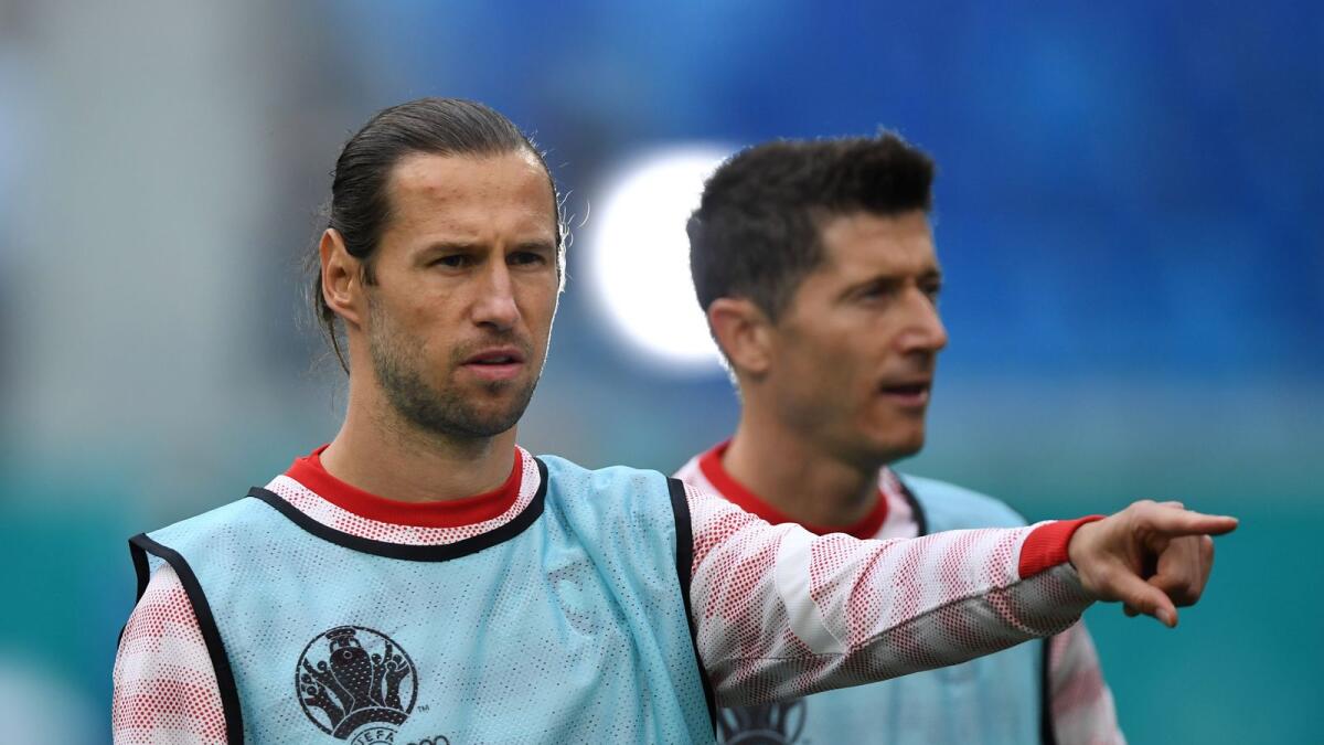 Poland's Grzegorz Krychowiak and Robert Lewandowski during the warm up before the match between Poland v Slovakia. — Reuters