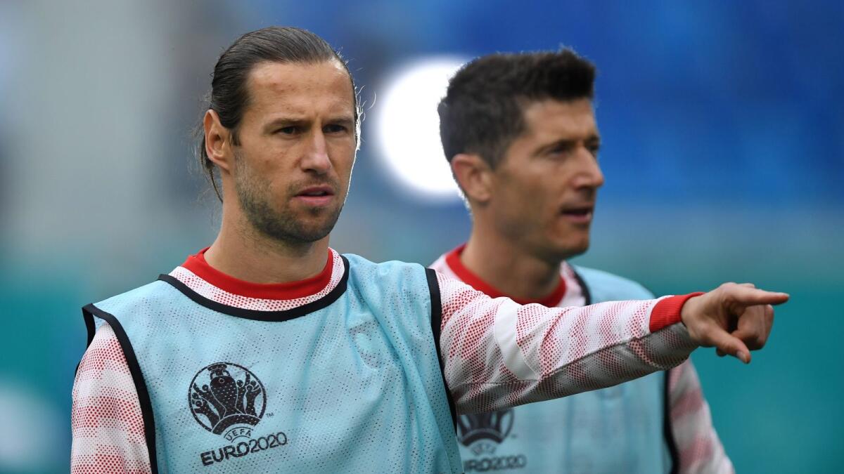 Poland's Grzegorz Krychowiak and Robert Lewandowski during the warm up before the match between Poland v Slovakia. — Reuters