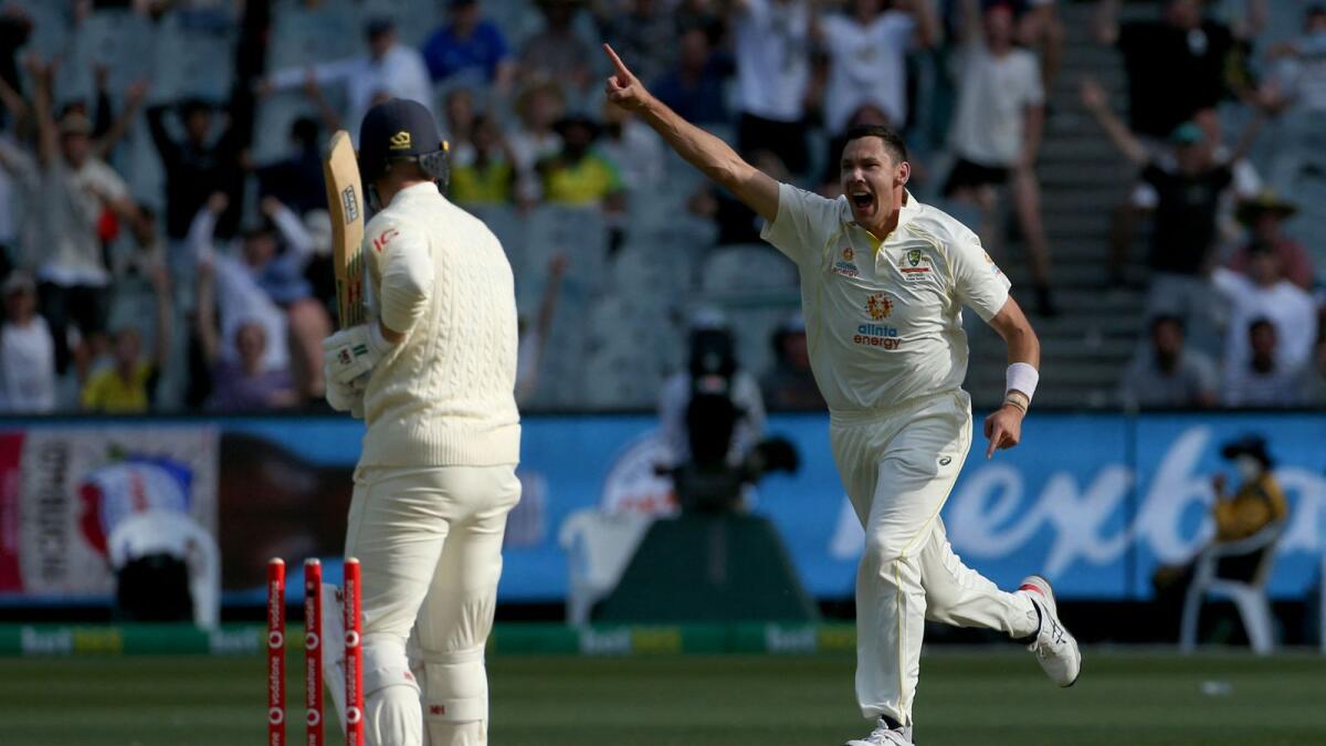 Australia's paceman Scott Boland celebrates after taking the wicket of England batsman Jack Leach. (AFP)