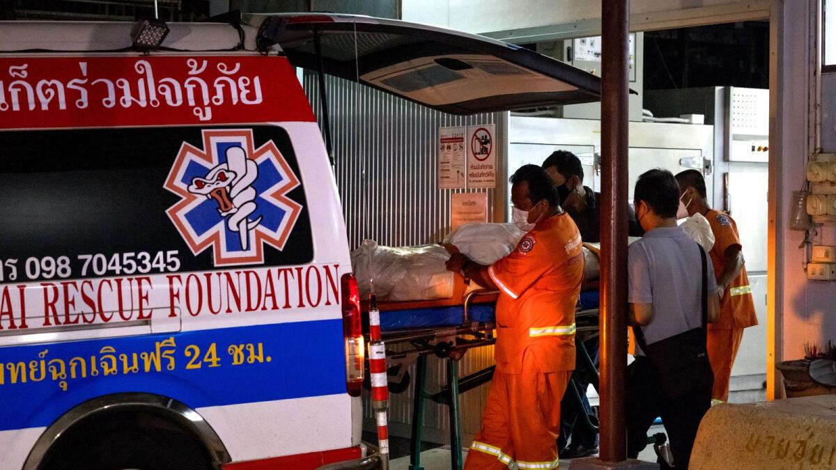 The body of Australian cricketer Shane Warne leaves Surat Thani Hospital morgue by an ambulance before being repatriated to Australia on Monday night. — AFP