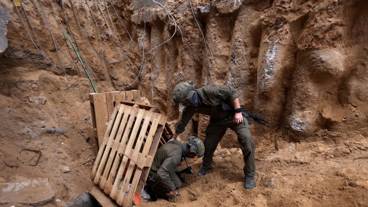 Israeli soldiers operate at the opening to a tunnel at Al Shifa Hospital compound in Gaza City, amid the ground operation against Hamas. Photo: Reuters file.