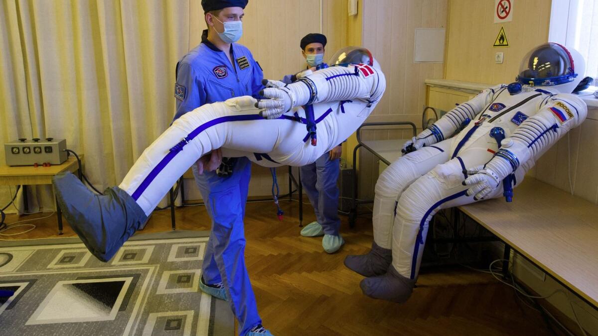 Employees prepare spacesuits at the Russian-leased Baikonur cosmodrome in Kazakhstan. The era of space tourism is on the horizon 60 years after Soviet cosmonaut Yuri Gagarin became the first person in space. — AFP file