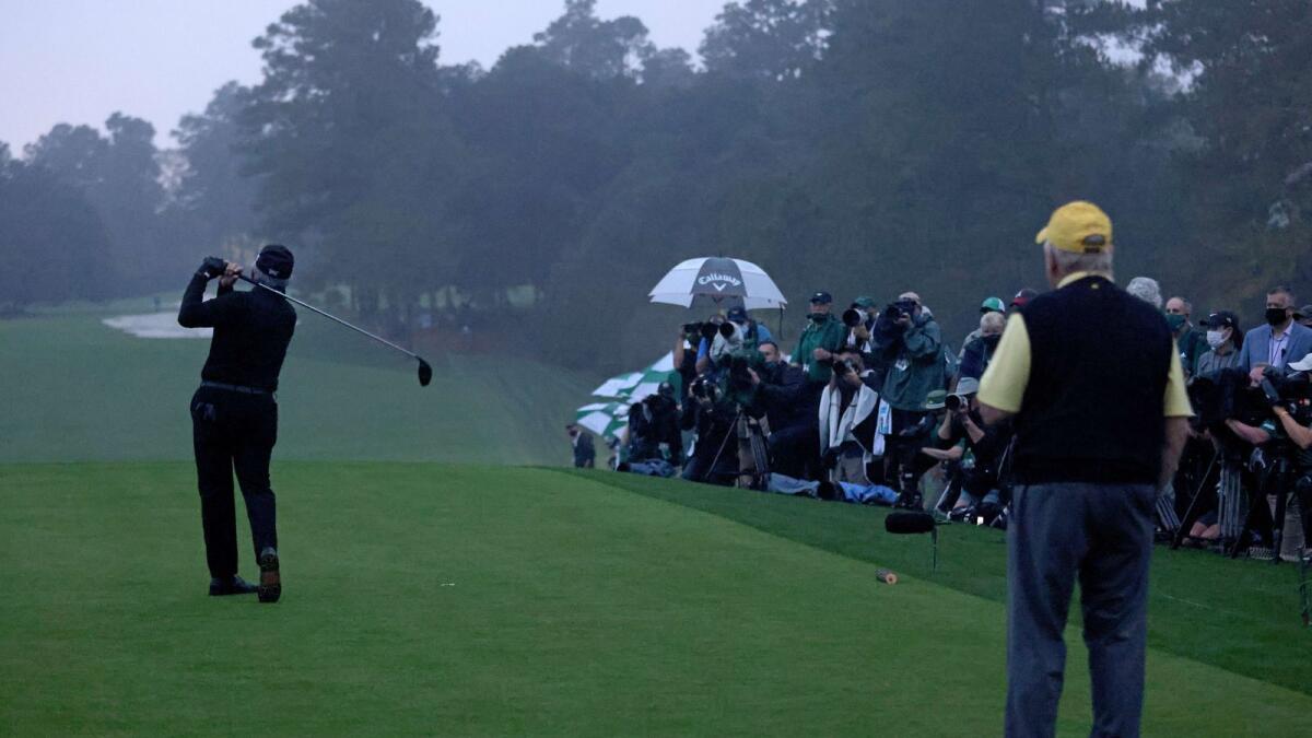 Honorary starter and Masters champion Gary Player of South Africa plays his opening tee shot on the first tee as Honorary starter and Masters champion Jack Nicklaus of the United States looks on during the first round of the Masters at Augusta National Golf Club. — AFP