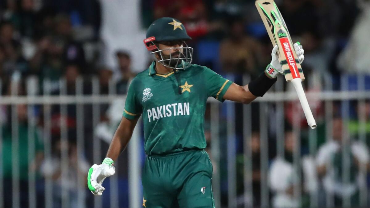 Pakistan captain Babar Azam celebrates after scoring a half century during the match against Scotland in Sharjah. (AP)