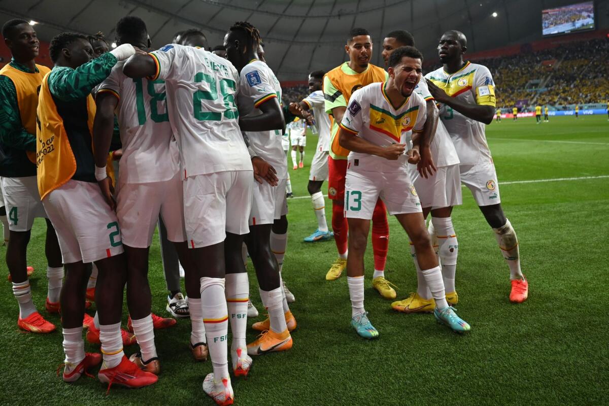 Senegal's players celebrate after Senegal's defender Kalidou Koulibaly scored their team's second goal. Photo: AFP