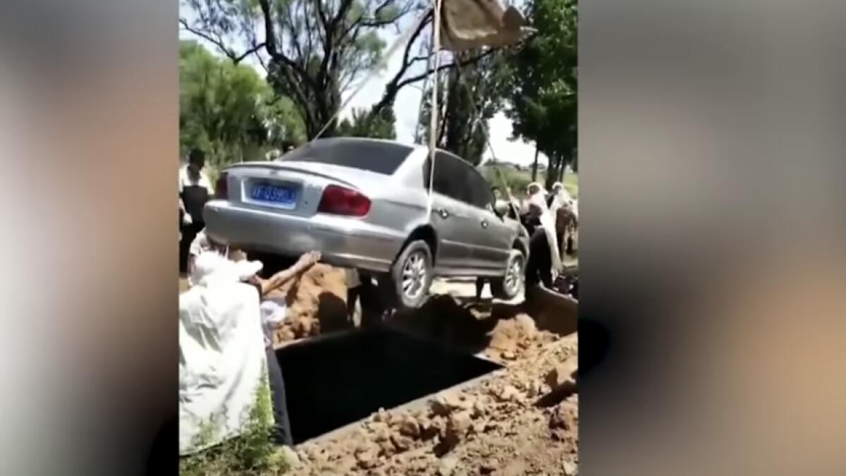 Video: Man granted dying wish, buried with his car   