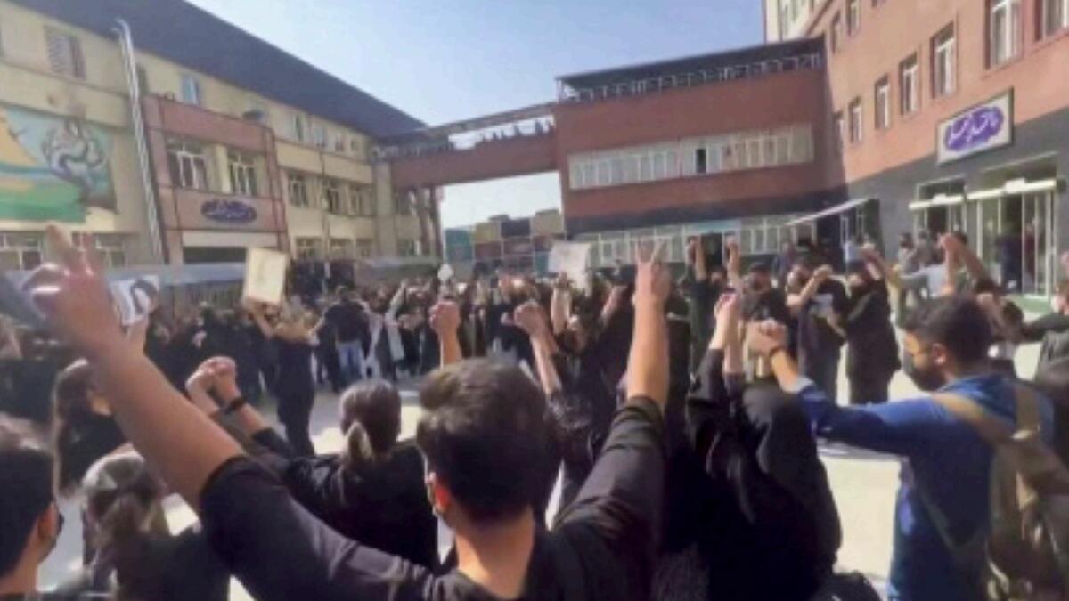 Screengrab from a video shows Iranian students chanting 'Freedom' as they rally at Tehran's University of Science and Culture. — AFP