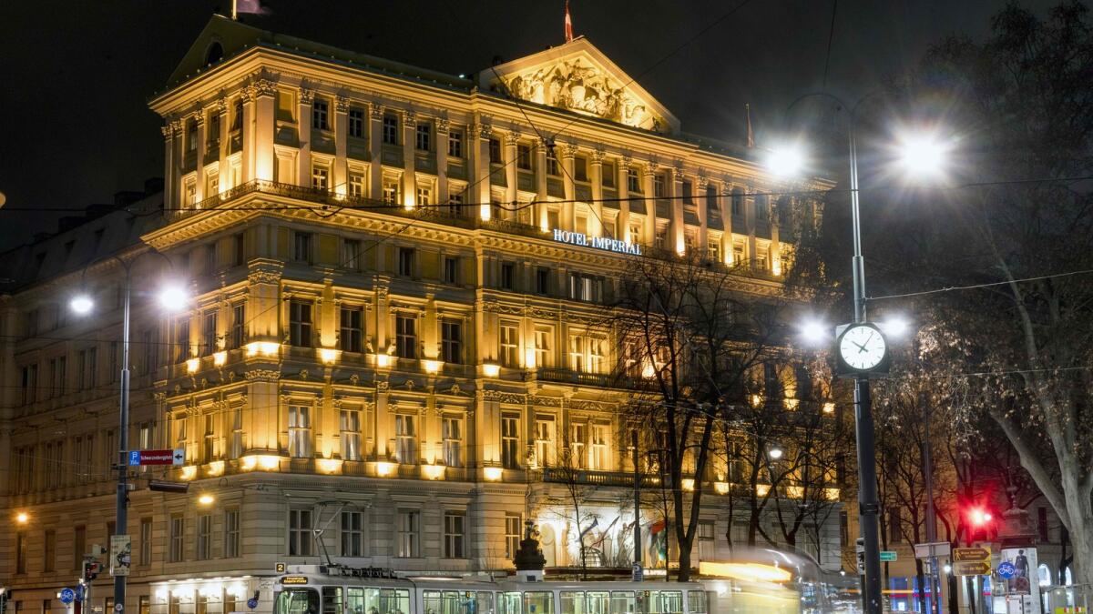 A picture taken with long exposure shows a tram driving past the Hotel Imperial in Vienna on February 17, 2016.  The 138-room Hotel Imperial in Vienna was originally built in 1863 as Prince Philipp of Württemberg?s residence. The Dubai conglomerate Al Habtoor Group has acquired the historic hotel from New York-listed Starwood Hotels and Resorts for USD 78,8 million./ AFP / JOE KLAMAR
