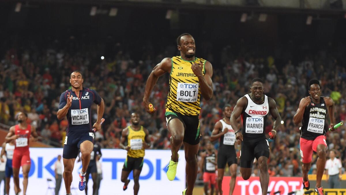 Usain Bolt crosses the finish line to win the final of the men’s 4x100 metres relay event ahead of France’s Jimmy Vicaut (left), Canada’s Justyn Warner (second right) and Antigua and Barbuda’s Miguel Francis (right) in Beijing on Saturday. 