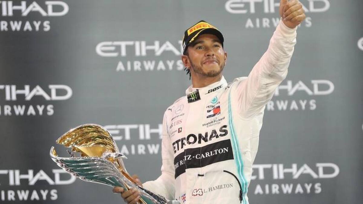Lewis Hamilton celebrates after winning the Abu Dhabi Grand Prix last year. - KT file