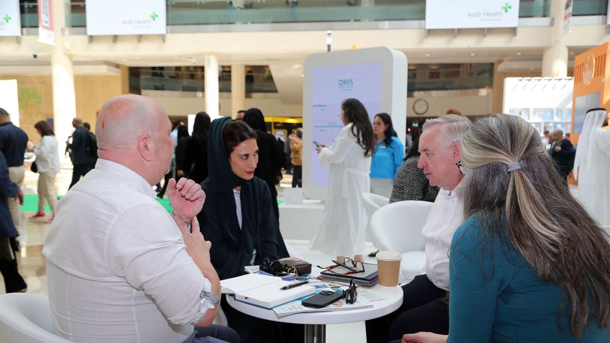 Dr Ibtesam Al Bastaki with other officials at the DHA stand at Arab Health 2023.
