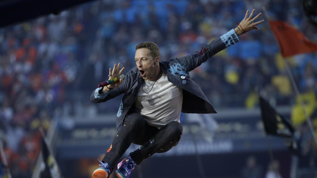 Coldplay singer Chris Martin performs during halftime of the NFL Super Bowl 50 football game Sunday, Feb. 7, 2016, in Santa Clara, Calif. (AP Photo/Marcio Jose Sanchez)
