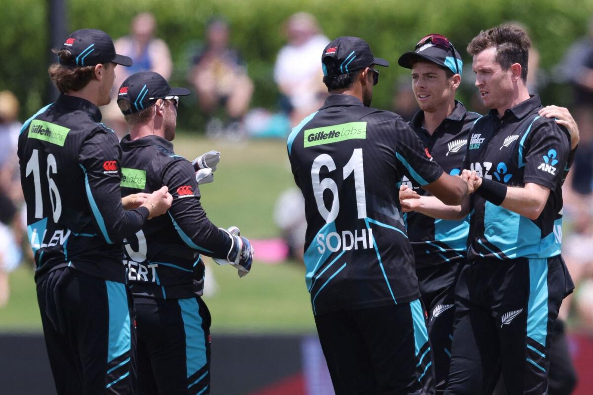 New Zealand's Adam Milne (right) celebrates with teammates after taking the wicket of Bangladesh's Najmul Hossain. — AFP
